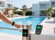 Professional photo of NFC wristband on a resort guest's wrist next to a pool access gate and contactless payment terminal