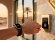 Professional lifestyle image showing NFC wristband on wrist near luxury resort entrance with discreet RFID reader and soft ambient lighting