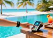 Waterproof silicone RFID wristband being tapped on a poolside payment terminal at a luxury all-inclusive resort, with ocean and palm trees in background