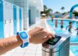 Waterproof silicone RFID wristbands being scanned at a water park gate entry with splash-proof reader, lockers in background, children playing under sunny skies.