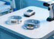 Barcode vs RFID patient wristbands comparison on hospital table with scanner