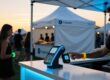 Cashless festival payment with RFID wristband at vendor POS terminal