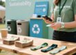 Eco-friendly RFID wristbands made from recycled paper and fabric displayed at a sustainable festival recycling station