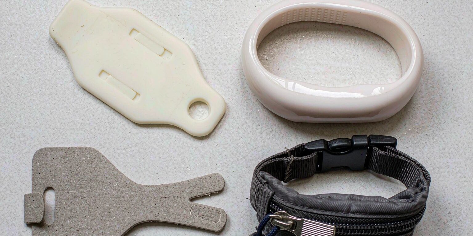 blog-cover-1791944726435 Side-by-side comparison of PVC, silicone, paper, and nylon RFID wristbands on a clean corporate background