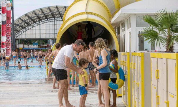blog-cover-1791945533944 Water park entrance with guests tapping RFID wristbands at a smart locker row